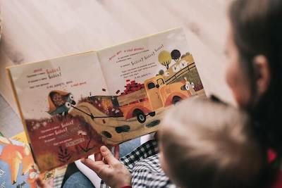 Mother reading a children's book to her son